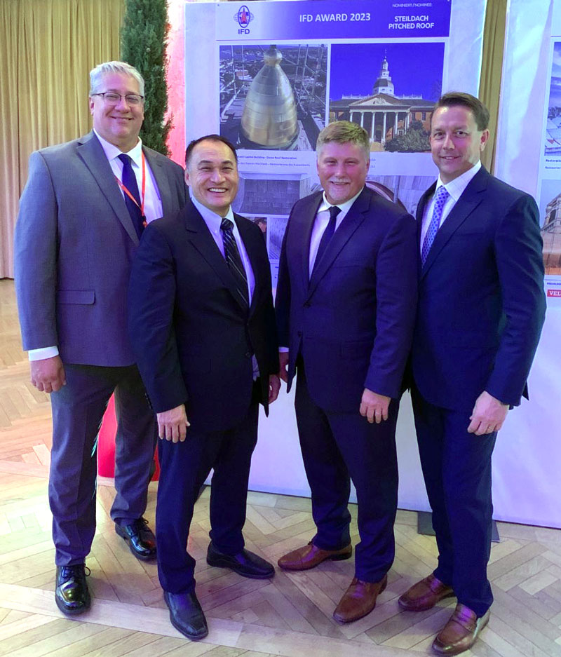 l-r, Lon Gorsch of Renaissance, John Chan and Gary Howes of Durable Slate, Robert Raleigh III of Renaissance at the 2023 International Federation for the Roofing Trades Congress and Award Competition in Bolzano, Italy. l-r, Lon Gorsch of Renaissance, John Chan and Gary Howes of Durable Slate, Robert Raleigh III of Renaissance.